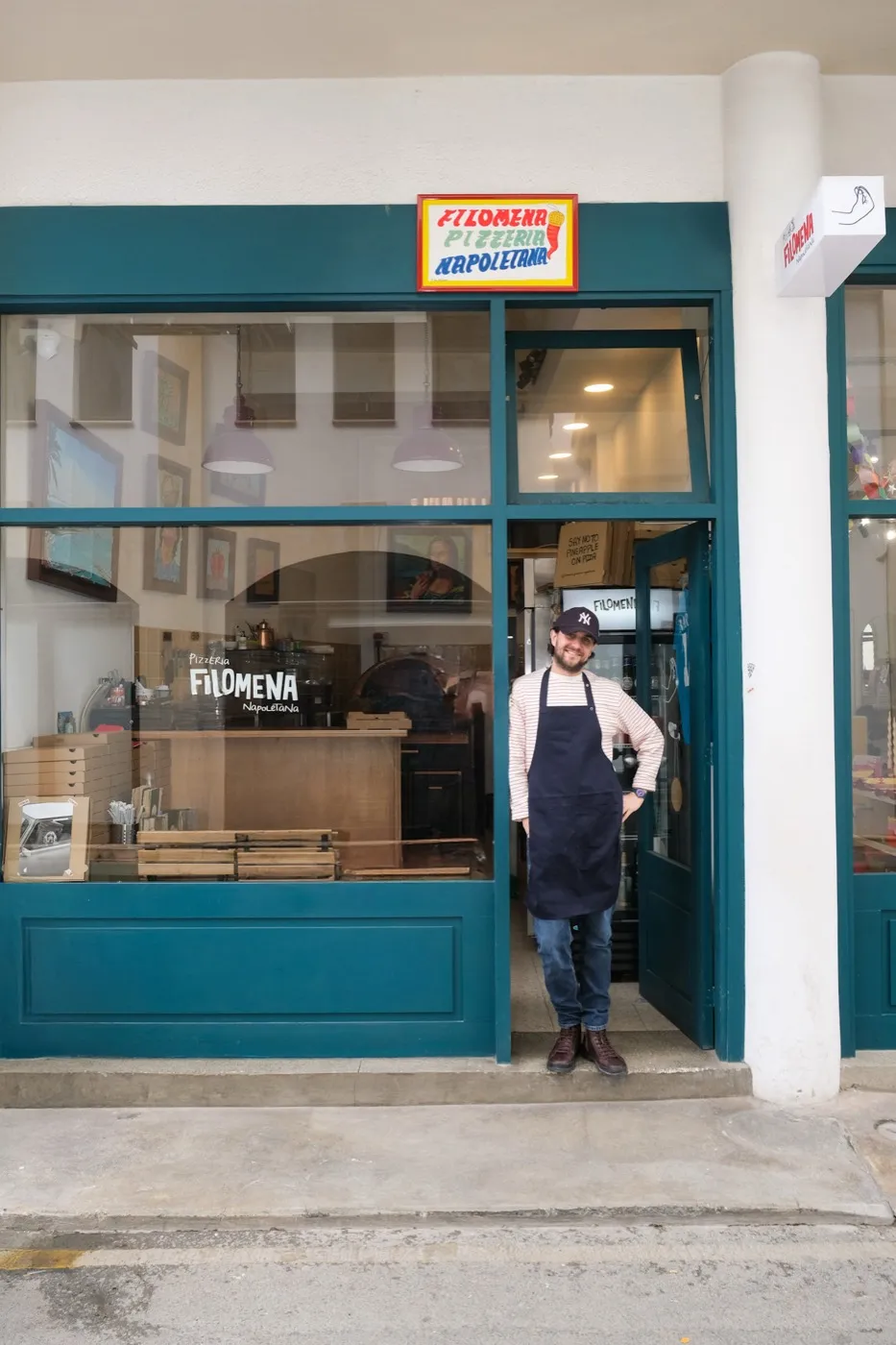 Daniele, the Naples-born pizzaiolo, in the doorway