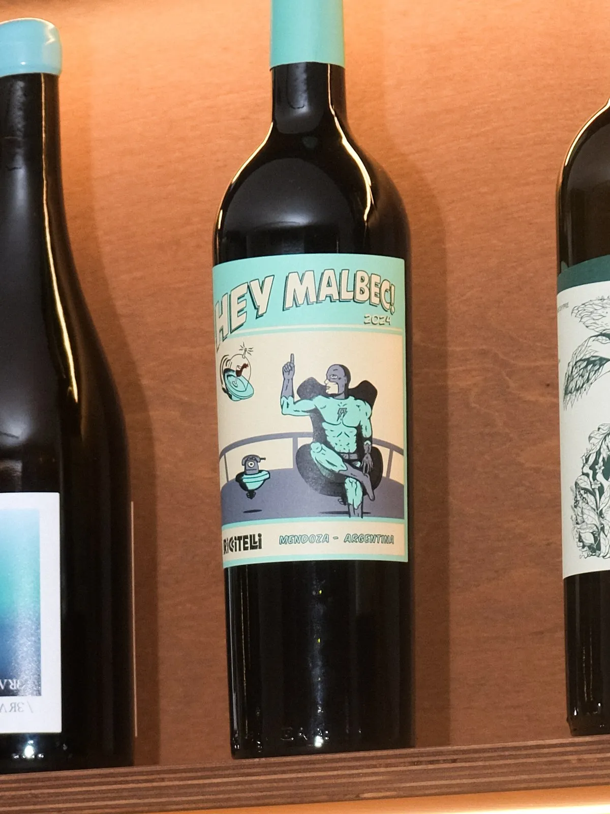 A bottle of Matías Riccitelli Malbec on the lit shelf at Filomena in Larnaca