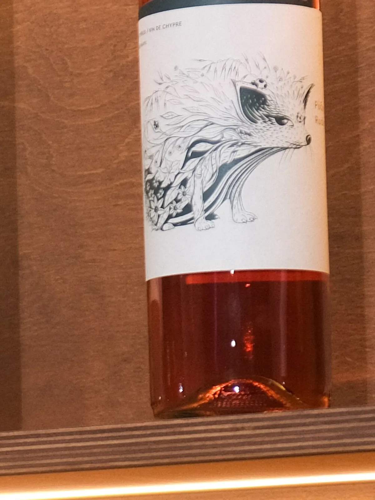 A bottle of Tsiakkas Grenache · Shiraz · Vamvakada · Xynisteri on the lit shelf at Filomena in Larnaca